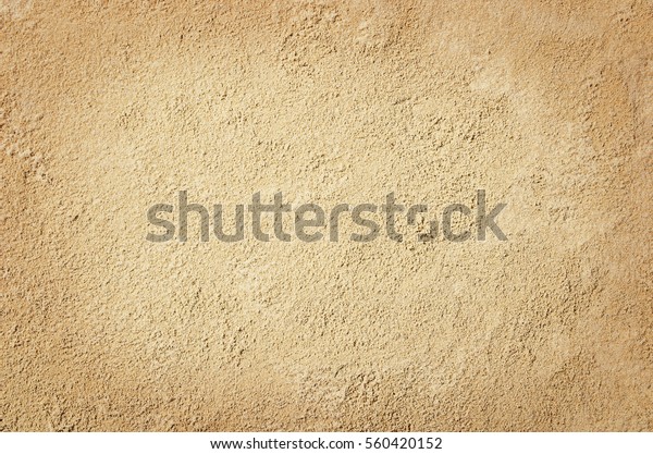Top view of sandy beach. Background with copy\
space and visible sand\
texture.