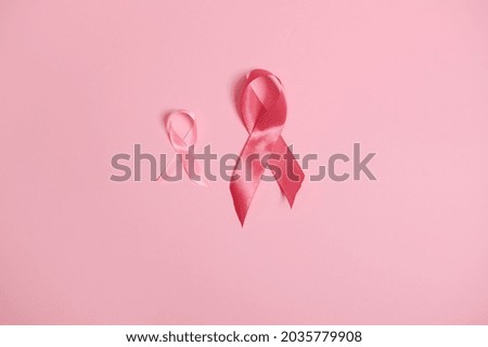 Top view of satin pink ribbons awareness, International symbol of Breast Cancer Awareness Month in October. October Pink day, World Cancer Day, national Cancer Survivor Say. Flat lay with copy space