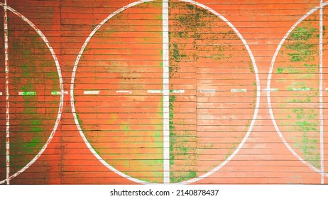 Top View Of The School Gym With Old Wooden Covering And Multi Colored Paints Of The World, Background Image, Empty Space For Your Slogan, Tinting, Vignetting, Selective Focusing