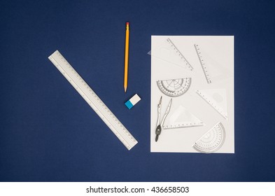 Top view of school, office or art designer accessories on a desk with copy space around products.
