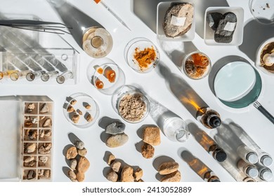 Top view of scientific equipment of geologist or archaeologist researcher working with soil, rock, stone or fossil sample in mineral, chemistry, paleontology, archaeological and geological laboratory. - Powered by Shutterstock