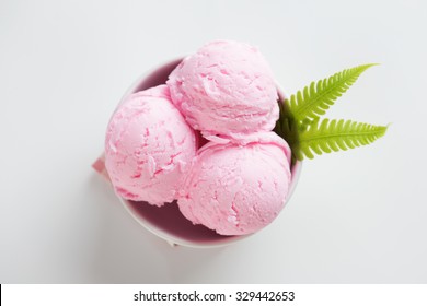 Top view scoop pink ice cream in bowl on white background.