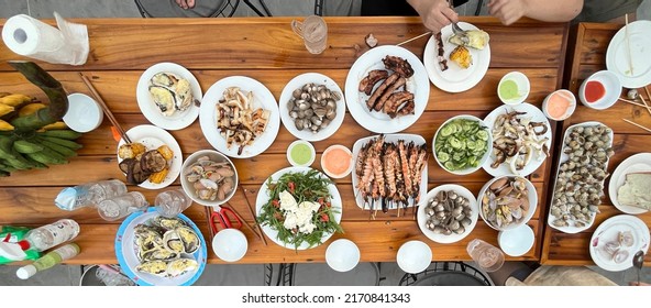 Top View Of Seafood Feast Bbq Table For Family Gathering