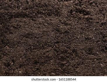 Top View Of Seamless Dark Soil Texture Background