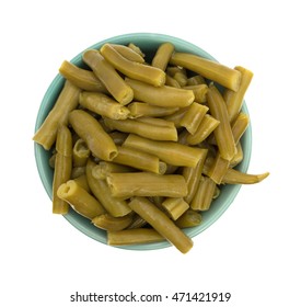 Top View Of A Serving Of Organic Cut Green Beans In A Small Bowl Isolated On A White Background.