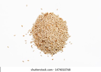 Top View Of Sesame Seeds Scattered On White Paper