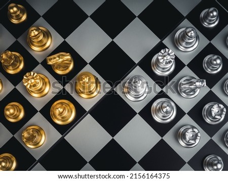 Top view of set of golden and silver chess pieces element, king, queen rook, bishop, knight, pawn standing on chessboard, close-up. Competition, game, war, emulation and planning concept.