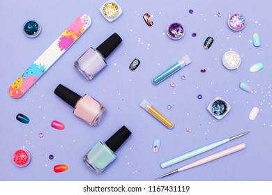 top view set for manicure   pedicure  varnishes  tools  sequins   exquisite nails bright background  Nail work flat lay concept  Stylish trendy female manicure 