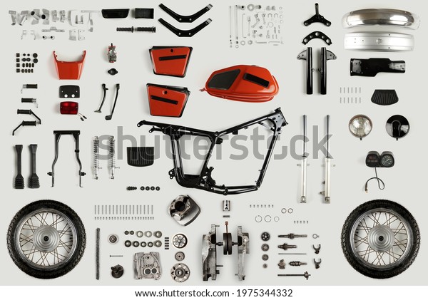 Top view of a set of motorcycle parts.\
Disassembled motorcycle on a light\
background