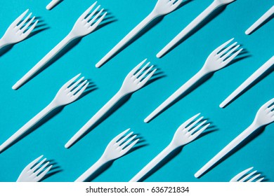 top view of set of plastic forks isolated on blue