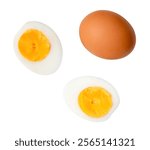 Top view set of raw chicken egg and cooked or boiled egg with egg yolk in two halves is isolated on white background with clipping path.