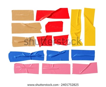 Top view set of torn multicolor adhesive vinyl or cloth tape in stripes is isolated on white background with clipping path.