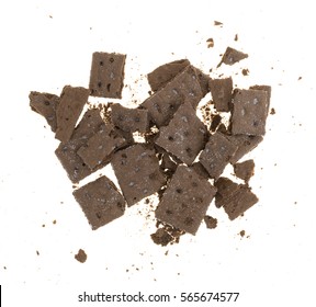 Top View Of Several Chocolate Graham Crackers That Have Been Broken Into Pieces With Crumbs Isolated On A White Background.