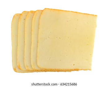 Top View Of A Several Stacked Slices Of Muenster Cheese Isolated On A White Background.