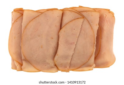 Top View Of Several Thin Smoked Turkey Slices Isolated On A White Background.