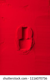 top view of shape of nail polish bottle on red powder