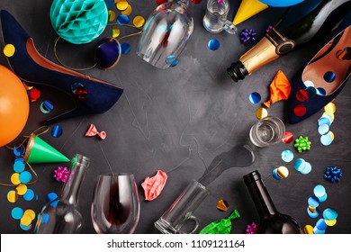 Top View Shot Of After A Party Celebration With Empty Bottles,wine Glass, Girl Shoes And Party Accessories