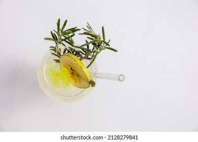 A top view shot of a cocktail with rosemary