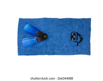Top view shot of snorkeling equipment lying on blue beach towel