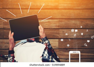 Top view shot of a woman holding digital tablet with a blank screen. Female hands holding blank digital tablet with infographics design elements of synchronizing process for contemporary devices - Powered by Shutterstock