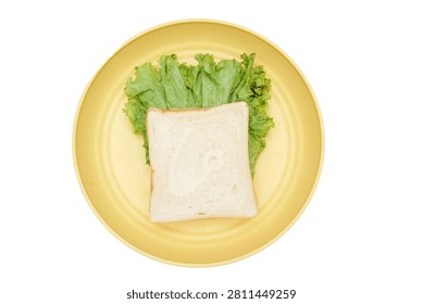 Top view of a simple white bread sandwich filled with green lettuce and served on a round yellow plate, isolated on a clean white background.