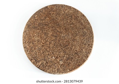 Top view of a simplistic brown circular hot pad mat crafted from sustainable cork material.