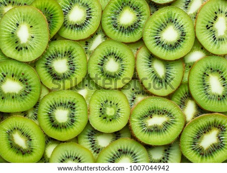 top view of sliced kiwi as background