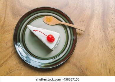 Top View Of A Slide Of Black Forest Cake On Wood Table 