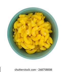 Top View Of A Small Bowl Filled With Macaroni And Cheese Atop A White Background.