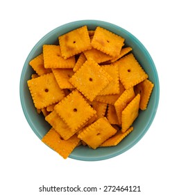 Top View Of A Small Bowl Filled With Cheese Snack Crackers Isolated On A White Background.