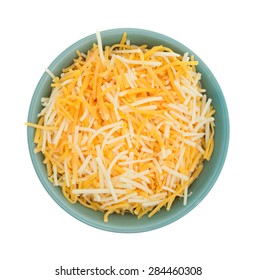 Top View Of A Small Bowl Filled With Shredded White Cheddar, Sharp Cheddar And Mild Cheddar Cheeses Isolated On A White Background.