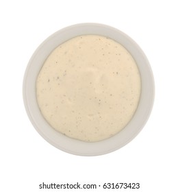 Top View Of A Small Bowl Filled With Creamy Ranch Dressing Isolated On A White Background.