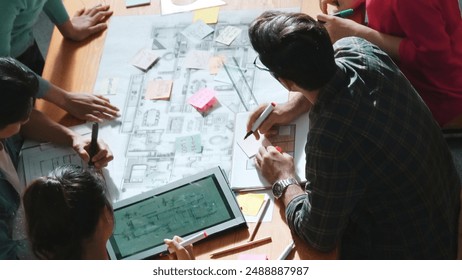 Top view of smart business team work together and holding wrist together at meeting room. Aerial view of smart architect engineer making circle by hold wrist. Represented unity, teamwork. Symposium. - Powered by Shutterstock