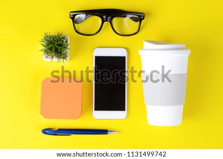 Similar – Business objects, cup of coffee, pen, phone and glasses.