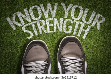 Top View of Sneakers on the grass with the text: Know Your Strength