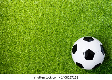 Top View Of Soccer Ball On Artificial Grass Feild Background With Copy Space