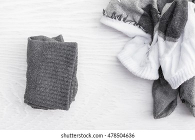 Top view of socks on wood background.