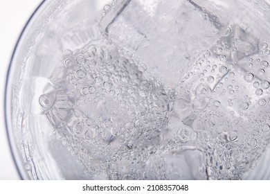 Top View Of Soda Water With Ice In Glass