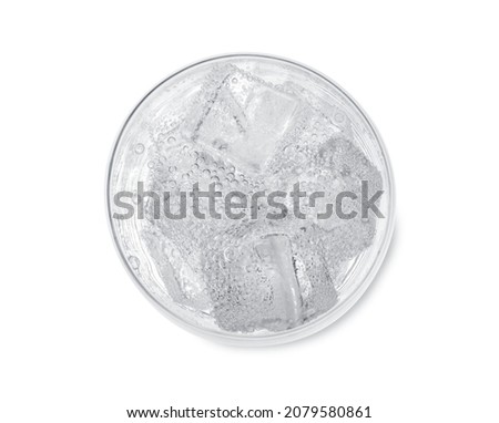Top view of soda water with ice in glass on white background