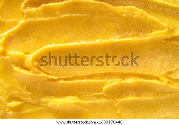 Top view of soft mango\
sorbet surface