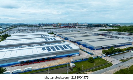Top View Solar Cell On Warehouse Factory. Solor Photo Voltaic Panels System Power Or Solar Cell On Industrial Building Roof For Producing Green Ecological Electricity. Production Of Renewable Energy. 