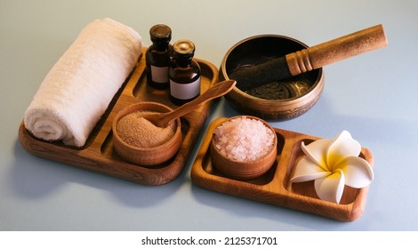 Top View Spa Set With  Singing Bowl, Oils, Sea Salt And Clay Scrub On A Wooden Tray. Self-care Concept.