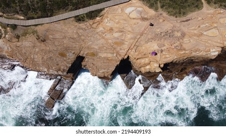 An Top View Of The Special Rock With Foamy Waves In Central Coast, Australia