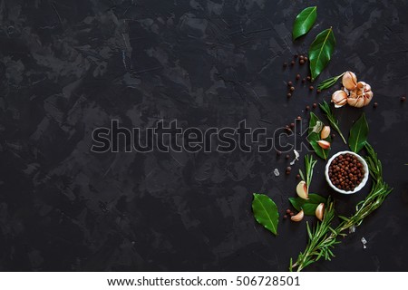Top view of spices on dark vintage background. 