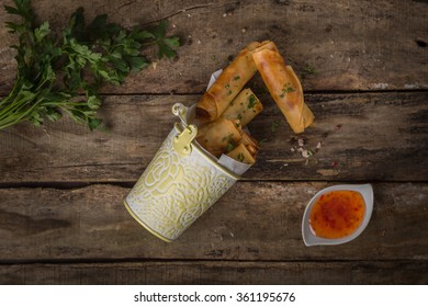 Top View Of Spring Rolls On Rustic Wooden Table