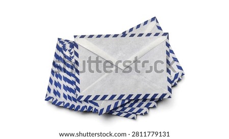 Top view of a stack of classic white and blue striped airmail envelopes, isolated on white background.
