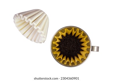 Top view stack of new basket-type disposable paper coffee filters and ground roasted coffee beans in paper coffee filter in metal cone holder isolated on white background with clipping path. - Powered by Shutterstock