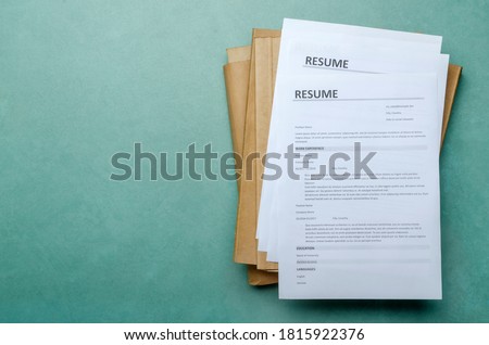 Top view of stack of office documents and cv forms on the desk.Empty space