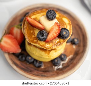 Top View Stack of Pancakes on Plate with Berries
