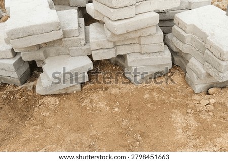 Top view of stacked concrete blocks with large empty space for text and advertising. Perfect for construction industry, architecture and engineering templates.